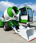 Badass Heavy Duty Self Loading Concrete Mixer Truck Designed For Continuous Commercial Concrete Supply And Smooth Daily Worksite Operations, green and white construction vehicle.