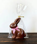 Heckin Great Cellophane Treat Bags 7 X 14 Inches With Gold Twist Ties 100 Pack Sturdy Opp Material Perfect For Cookies Candy Snacks Chocolate Marshmallow Wrapping featuring a chocolate bunny.
