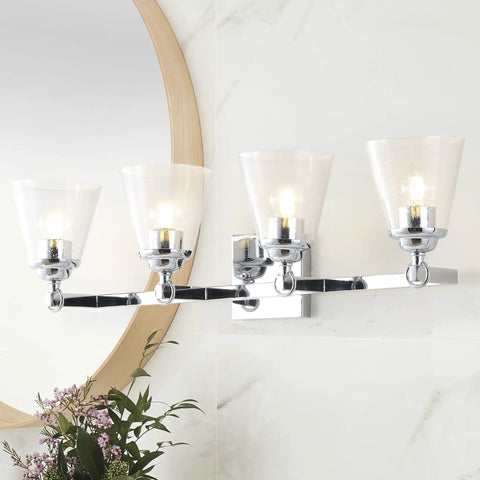 Chrome 4-Light Vanity Light Wall Sconce with clear seeded glass shades, reversible mount in a bathroom setting, 28.5 inch long.