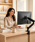 Top Shelf Single Monitor Arm Desk Mount With Ballistic Mechanical Springs For 17 To 32 Inch Screens in a stylish home office setup.