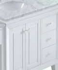 Top Shelf Carrara White Marble Bathroom Vanity With A Sleek Single Sink Setup And Rock Solid Wood Cabinet Featuring Brushed Nickel Knobs For That Go To 67 Inch Clean Slick Vibe close-up of countertop and cabinet