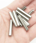 Hand holding Spring Type Elastic Cylindrical Cotter Pin Set In 304 Stainless Steel Sizes From M1.5 To M10 Includes M1.5 M2 M2.5 M3 M4 M5 M6 M8 M10 Rust Resistant Durable Straight Pins For Machinery DIY Projects