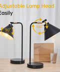 Sleek Black Dimmable Nightstand Lamp With USB Ports And AC Outlet showing adjustable lamp head angles