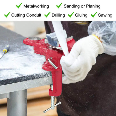 Beefy Universal Table Vise 3 Inch Jaw Opening With 360 Degree Swivel Base Bench Clamp For Woodworking And Metalworking, Thickened 0.2 Inch Jaw For Grip That Won't Budge, Fits Most Workbenches. red cast steel bench vise clamping a workbench for metalworking and sawing