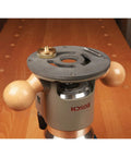 Heavy Duty CNC Milled Acetal Resin Router Baseplate Designed For Bosch 1617 Fixed Base Workshop Rigs Featuring Standard Bushings And Super Dead Simple Mount Kit on router with wood handles.