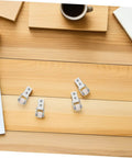 Six Pack Heavy Duty Nylon Sliding Door Rollers With Track Guide Built Tough Galvanized Brackets displayed on a wooden table.