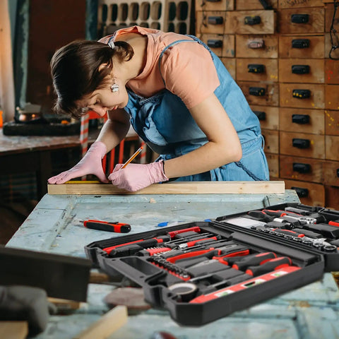 Person using All In One 38 Piece Home Tool Kit With Portable Box The Starter Set For Dorm Life Office Fixes And Auto Repairs Durable Chrome Plated Hand Tools For DIY Projects And Car Maintenance on a wooden board