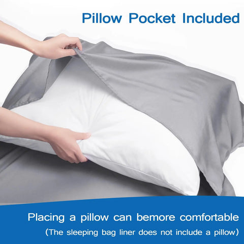 Hands placing a pillow into gray Ultra Soft Microfiber Sleeping Bag Liner With Heavy Duty Two Way Zipper For Hotels And Hostels.