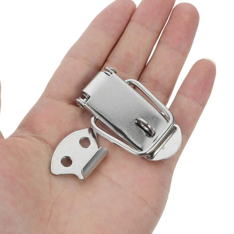 Hand holding Spring Loaded Toggle Latch Catch Stainless Steel Lockable Clip For Toolboxes And Suitcases Heavy Duty Metal Fastener