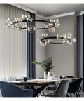 High Quality Top Shelf Modern Metal Chandelier With Clear Glass Bubbles And G9 Sockets in dining space with gray curtains.