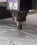 ER25 A M32 Collet Clamping Nut With Dynamic Balance Holes For CNC Lathe And Milling Tool Holders in operation on a CNC machine, black.