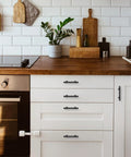 Kitchen with white cabinets fitted with Matte Black Cabinet Handles Set of 10 - 3 Inch Center Hole Zinc Alloy Square Bar Drawer Pulls