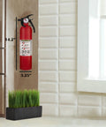 Get Your House Fortified With This Killer Set Of Seven Red Multipurpose Fire Extinguishers Rated 1-A 10-B-C Including A Sturdy Cleaning Cloth To Keep Your Gear Looking Sharp And Always Ready When You Need It Most, mounted red fire extinguisher, 14.2 inches tall, 3.25 inches wide, in home setting.