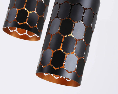 Close-up of the cylindrical metal cage shade from the 3 Light Modern Kitchen Island Pendant Lights With Cylindrical Metal Cage