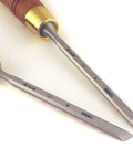 Right And Left Six Millimeter Paring Chisels One Quarter Inch Wide Skew Ground At Thirty Degrees With Twenty Five Degree Bevel on white