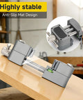Upgraded Eight Jaw Mini Fractal Vise With 90Mm Wide Opening and Self Adjusting Jaws for securing delicate pieces on a workbench.