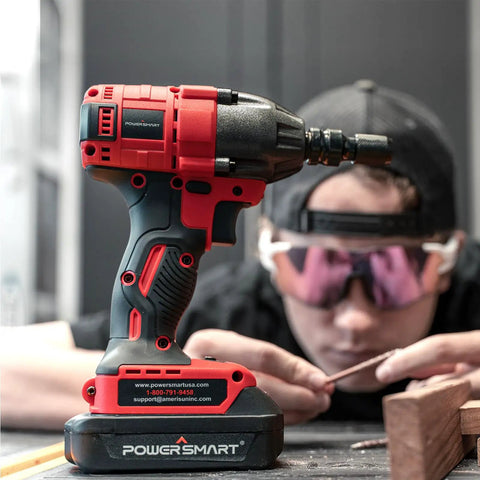 Person using Cordless Half Inch Brushless Impact Wrench Kit For Cars Trucks RVs And Home Use 20V 2Ah Battery With Charger And 5 Sockets