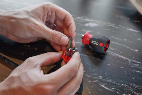 Person assembling Compact Stubby Screwdriver With Six In One Torx Bits T8 T10 T15 T20 T25 T30 Soft Finish Cushion Grip for on-the-go fixes