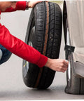 Man installing Spare Tire Bolt Retainer Clamp for Vehicle Wheels to secure tire on car, easy install tire hold down hardware.