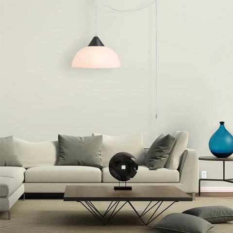Living room with modern furniture and 1 Light Plug-In Pendant Light In Dark Bronze With Frosted Shade And Adjustable Clear Cord Height
