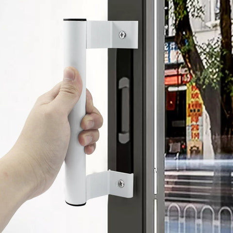 Person holding Two Pack 8 Inch Aluminum Sliding Door Handles For Glass Doors White Includes Four Mounting Screws Fits Six And Five Eighths Inch Mounting Holes For Patio Glass Door And Barn Door Durable Aluminum Build With Smooth Operation on a glass door.