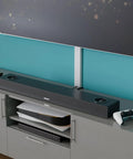 Slick Low Profile TV Wall Mount Cord Hider, Paintable Self Adhesive Cable Raceway For A No Sweat Install, Seamless Double Pack White Cover With Hidden Hinge For A Top Shelf Look, mounted with a soundbar.