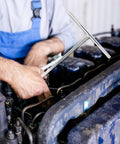 High Carbon Steel T Handle Socket Wrench With Hex Grip For Zero Play And Max Torque in use on an engine for auto repair.