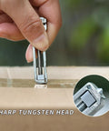 Demonstrating the Pocket Size Mini Multitool Wrench With Bottle Opener's sharp tungsten head cutting tape on a box.