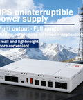Compact Mini UPS Battery 8000mAh DC Backup Power Unit With Smart Safety Shields Plug And Play Energy Reserve Built Solid on outdoor table.