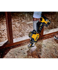 Person using Atomic 20V Max One-Handed Cordless Reciprocating Saw Tool Only with Brushless Motor in compact space.