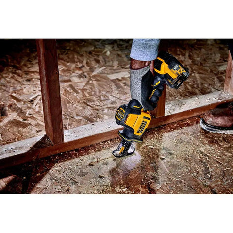 Person using Atomic 20V Max One-Handed Cordless Reciprocating Saw Tool Only with Brushless Motor in compact space.