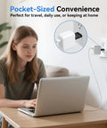 Woman using laptop with EU To US Travel Plug Adapter 2 Pack With Secure Fit Type C And E F Schuko To US Converter on wall outlet