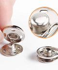Close-up of 120 Set Sew-On Metal Snap Buttons Pack With 8mm And 10mm Sizes In Black And Silver, Durable Iron Fasteners for Sewing.