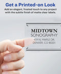 Hand holding a clear matte label showcasing a printed business address, demonstrating the Straight Up Game Changing Full Sheet Printable Shipping Labels 8.5 X 11 Inch.