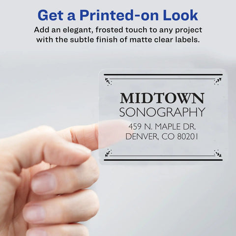 Hand holding a clear matte label showcasing a printed business address, demonstrating the Straight Up Game Changing Full Sheet Printable Shipping Labels 8.5 X 11 Inch.