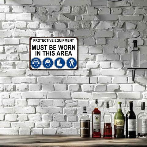 Must Wear Protective Equipment Area Aluminum Sign 8x12 Inch on white brick wall above bottles