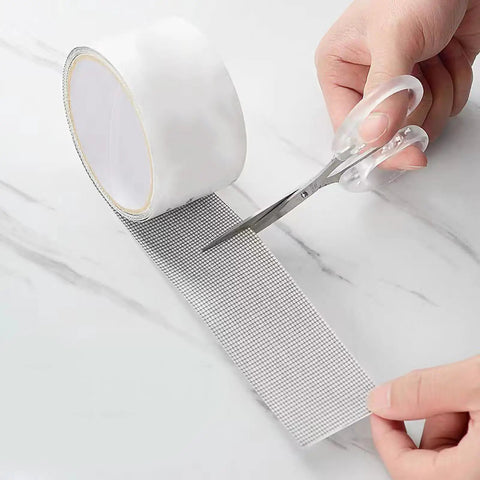 Window Screen Repair Patch Tape No Fuss Self Adhesive Mesh Patch With Double Sided Adhesive being cut for easy home repair