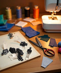 6 Piece Black Universal Zipper Repair Kit With Quick Fix Sliders For No Tool Needed Replacement on sewing table.