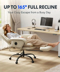 Person reclining on 2 In 1 Chaise Lounge Chair With Wheels For Cozy Lounging Leather Recliner With Extendable Footrest And 90 To 165 Degree Backrest Lumbar Support For Living Room Bedroom Home Office Or Study Beige White HC4 near desk