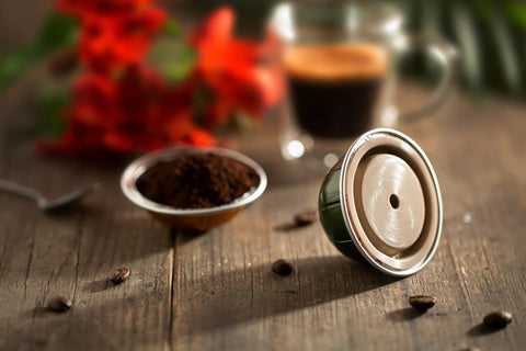 Reusable Silicone Capsule Cap For Nespresso Vertuo And VertuoLine Refills Made Easy Mess Free Compatible And Food Grade Italian Made Quality Pack Of 2 Caps Easy To Clean on table with coffee and red flowers