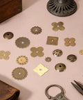 Assorted vintage brass shapes, highlight of Six Piece Brass Cabinet Backplates Set 1 Inch For Doors Drawers Cupboards And Closets.