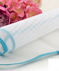 Protective Ironing Pad For Steam Irons 23 By 15 Inches Two Pack Durable Washable Polyester Mesh Shield Keeps Clothes From Scorching And Shine While Protecting Iron Surface From Zippers And Snaps next to pink flowers