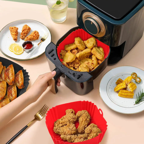 User placing a red Two Pack Silicone Air Fryer Liners For Three To Five Quart Baskets Reusable Nonstick Insert in air fryer with food