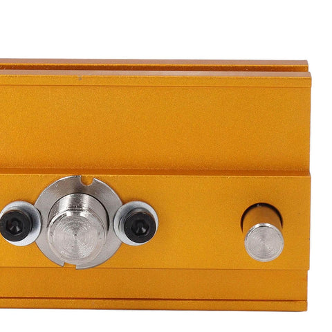 Close-up of Auto Centering Dowel Jig Kit With Adjustable Drill Guide From 0.4 To 2.4 Inches Wide Six Bushings in gold finish