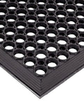 Close-up of anti fatigue drainage rubber matting for indoor and outdoor use built tough, heavy duty non slip floor mats for workshops.