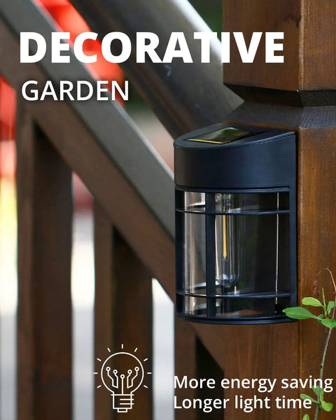 Black solar fence light installed on wooden fence post, part of 12 Pack Solar Fence Lights Outdoor Waterproof Lighting For Fence Garden Yard Deck And Stairs Auto On Solar Powered Weatherproof No Hassle Install Bright Warm Glow To Elevate Pathways And Patio Ambience.