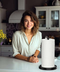 One Hand Tear Paper Towel Holder For Countertop Black Stainless Steel With Weighted Base in kitchen setting with a person nearby