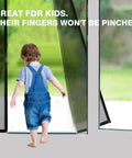 Child walking through magnetic screen door 36 X 82 inches, heavy duty reinforced fiberglass mesh, black modern style.