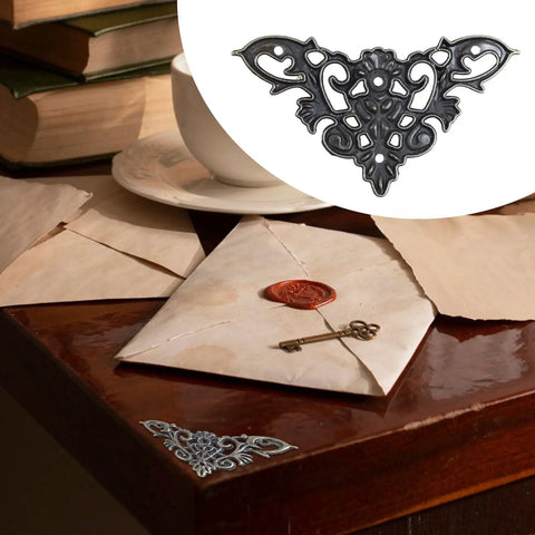 Rock Solid Antique Bronze Corner Protectors With 20 Pack Decorative Metal Edge Guards For Books Photo Frames Wooden Crates Straight Up Vintage Charm Real Deal Scratch Shield on a wooden table with letters and a key.