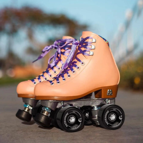 Peach quad roller skate with 8 Pack 65 X 36 mm Quad Roller Skate Wheels 78A With ABEC 9 Bearings Installed for rinks and streets.